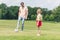 father and cute little daughter playing with soccer ball