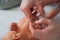 Father cuts the newbornâ€™s nails. Manicure a child close-up. Newborn baby care concept