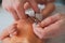 Father cuts the newbornâ€™s nails. Manicure a child close-up. Newborn baby care concept