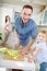 Father cuts salad with a knife