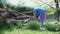 Father and daugher sawing wood in slow motion