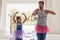 Father with daughter, ballet dancing and teaching with learning at home in tutu, bond with love and creativity. Family