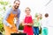 Father and daughter barbecue together