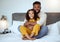 Father daughter, bed embrace for black family and bedtime portrait for bonding love, parent care and happiness. Dad