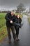 Father and daughter with broken umbrella