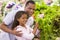 Father and daughter buying fresh produce