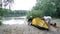 Father and daughter campers putting up tent. Green tourism, hiking. Happy travels concept.