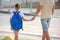 Father and daughter  cross the pedestrian crossing. Back to school.