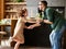 Father and daughter dancing with music together at home