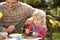 Father And Daughter Decorating Easter Eggs