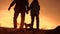 Father and daughter with a dog teamwork happy family tourists silhouette concept navigation . team dad and daughter on