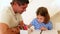 Father and daughter drawing together at the table