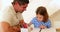 Father and daughter drawing together at the table