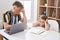 Father and daughter father and daughter stressed using laptop studying at home