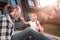 Father and daughter feeling relaxed sitting outside their house