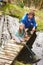 Father And Daughter Fishing In Pond With Net