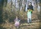 Father and daughter gathering garbage in the park