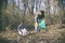 Father and daughter gathering garbage in the park