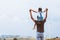 Father and daughter having fun to play together. Asian child girl riding on father`s shoulders