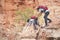 Father and daughter hiking climbing in mountains