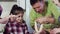 Father and daughter indulge in the kitchen baking dough.