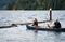 Father and daughter in life jackets and husky dog rowing in boat on the troubled Merwin Lake