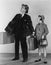 Father and daughter with luggage