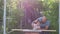 Father and daughter painting old wood in the garden close up. Home workshop, handicrafts, hand-made concept