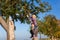 Father and daughter picking apple in autumn or fall