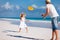 Father and daughter playing frisbee