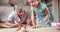 Father And Daughter Playing With Train Set In Bedroom