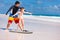 Father and daughter practicing surfing