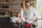 Father and daughter preparing cookie on worktop