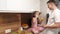 Father and daughter preparing sandwiches on Father\'s Day