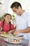 Father And Daughter Preparing Sushi Together