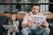 Father and daughter reading sport news and business newspapers at home