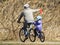 Father And Daughter Riding Bikes In The Park