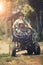 Father and daughter riding on quad atv on dirt field