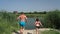 Father and daughter running and jumping into the river, summer country holidays