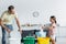 Father and daughter sorting garbage in