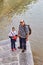 Father and daughter are standing by the river, Isfahan, Iran.