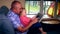 Father with daughter use tablet to watch movie Free time 4K