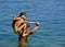 Father with daughters in fun on sea