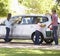 Father And Daughters Washing Car Together