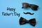Father day and male hipster fashion concept with minimalist image of a pair of square sunglasses, black bowtie and a fake