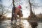 Father and doughter riding in the nature