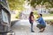 Father Dropping Off Daughter In Front Of School Gates