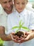 Father educate son to care a plant