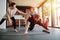 Father entertaining his baby while doing single arm plank at home