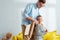 Father fixing carton plane wings on